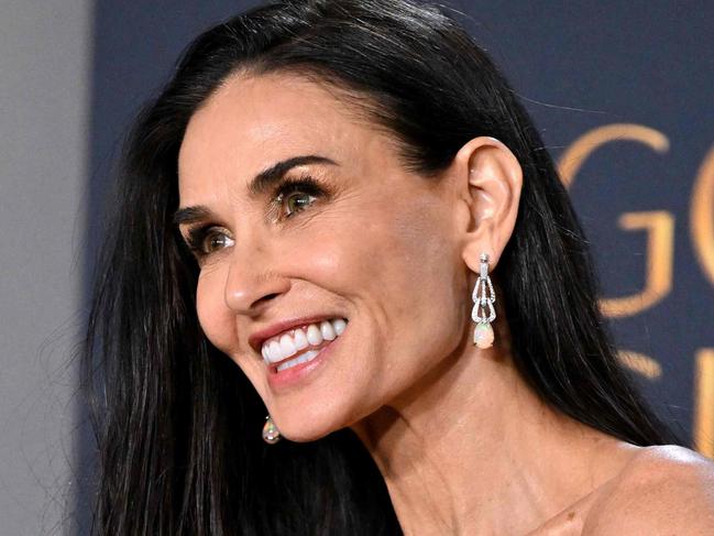 US actress Demi Moore poses with the Best Performance by a Female Actor in a Motion Picture â Musical or Comedy award for "The Substance" in the press room during the 82nd annual Golden Globe Awards at the Beverly Hilton hotel in Beverly Hills, California, on January 5, 2025. (Photo by Robyn Beck / AFP)