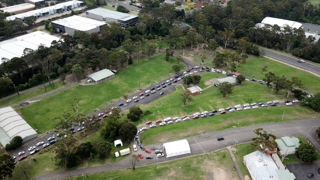 A long line of cars waiting at the Castle Hill Showground drive-through testing clinic. Picture: Jonathan Ng