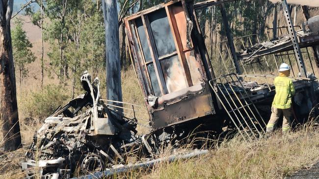 The charred remains of a semi trailer from which the driver was pulled to safety as it burned following a two truck crash on the Bruce Highway, 37km south of Miriam Vale, on August 5. Picture: Rodney Stevens