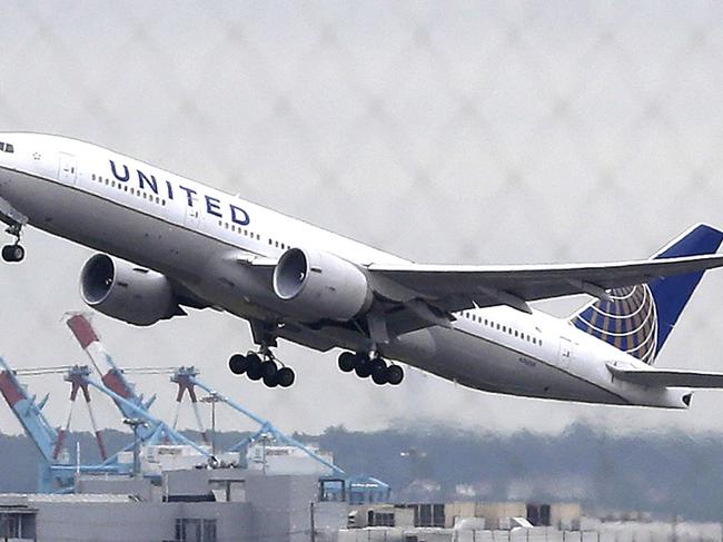 FILE - In this July 25, 2013, file photo, a United Airlines plane takes off from Newark Liberty International Airport, in Newark, N.J. United Airlines let is club liquor license lapse in Newark, leading to two days, Wednesday, Sept. 28 and Thursday, Sept. 29, without alcohol. The membership club offers free drinks to frequent fliers. (AP Photo/Julio Cortez, File)