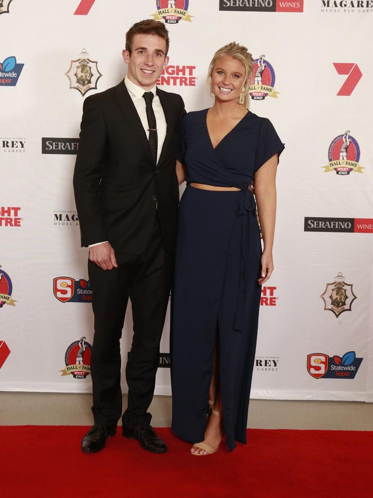 Joel Cross and Alice James pose for a picture on the red carpet at Adelaide Oval in North Adelaide, for the Magarey Medal, Monday, September 9, 2019. Picture: Matt Loxton