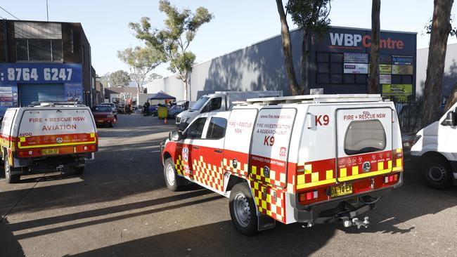 Fire and Rescue NSW K9 unit arriving at crime scene in a business on the corner of Milperra Road and Queen Street at Milperra. Picture: Richard Dobson