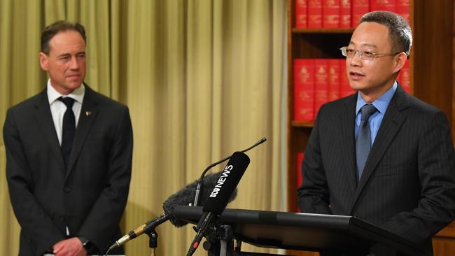 Federal Health Minister Greg Hunt (left) listens to China’s Victorian consul-general Long Zhou who made an unexpected appearance at his press conference on April 29. Picture: AAP