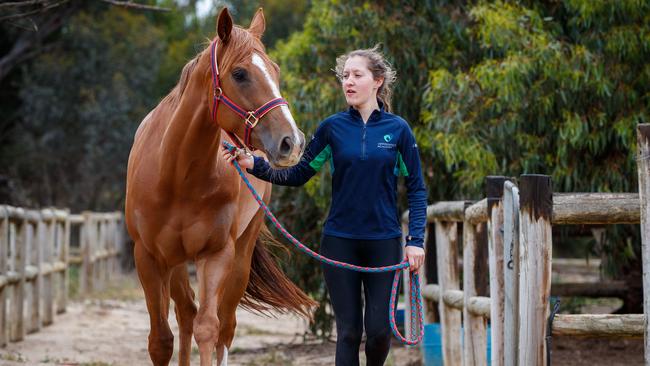 Maggie Collett with Trip at David Jolly's stables in Goolwa. Picture: Matt Turner