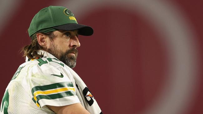 GLENDALE, ARIZONA - OCTOBER 28: Quarterback Aaron Rodgers #12 of the Green Bay Packers watches from the sidelines during the second half of the NFL game at State Farm Stadium on October 28, 2021 in Glendale, Arizona. The Packers defeated the Cardinals 24-21. (Photo by Christian Petersen/Getty Images)