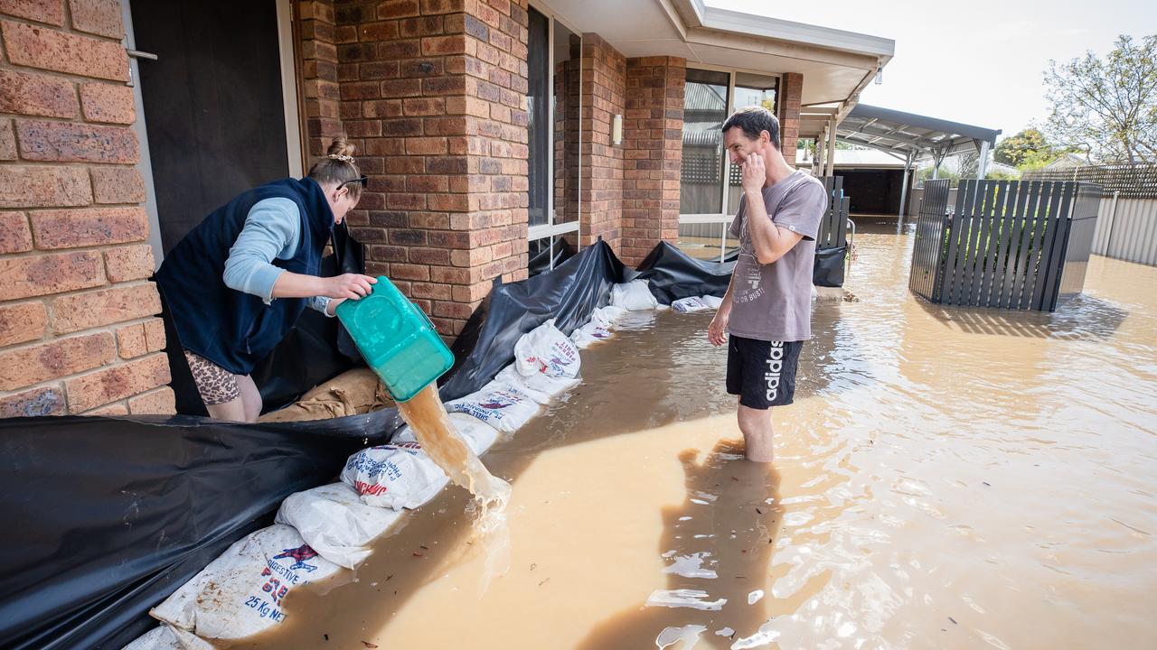 Rebecca and Howard work to save their Rochester home. Picture: Jason Edwards