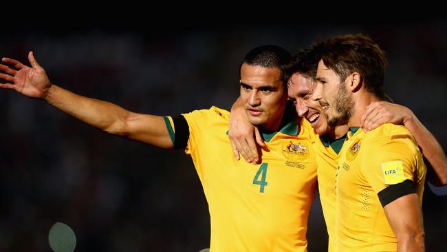 Mark Milligan with Mathew Leckie and Tim Cahill.