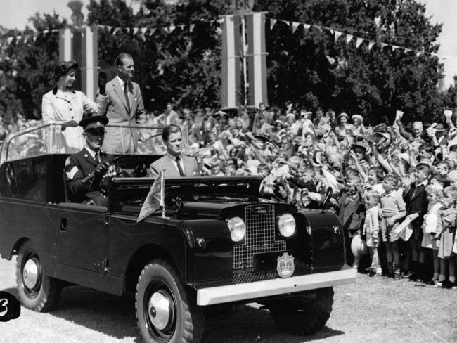 Queen Elizabeth enjoys one of her visits to Tasmania in the 1950s. A crowd of 12,000 schoolchildren, possibly including Charles Wooley’s childhood nemesis Jack, lined up to greet the Queen and Prince Philip at York Park Oval in Launceston. Picture: Courtesy of the Mercury archive.