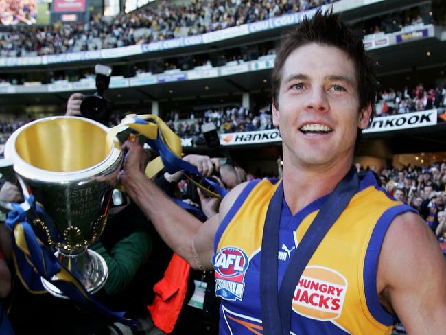 MELBOURNE, AUSTRALIA - SEPTEMBER 30:  Ben Cousins of the Eagles celebrates with the trophy after the AFL Grand Final match between the Sydney Swans and the West Coast Eagles at the Melbourne Cricket Ground on September 30, 2006 in Melbourne, Australia.  (Photo by Mark Dadswell/Getty Images)