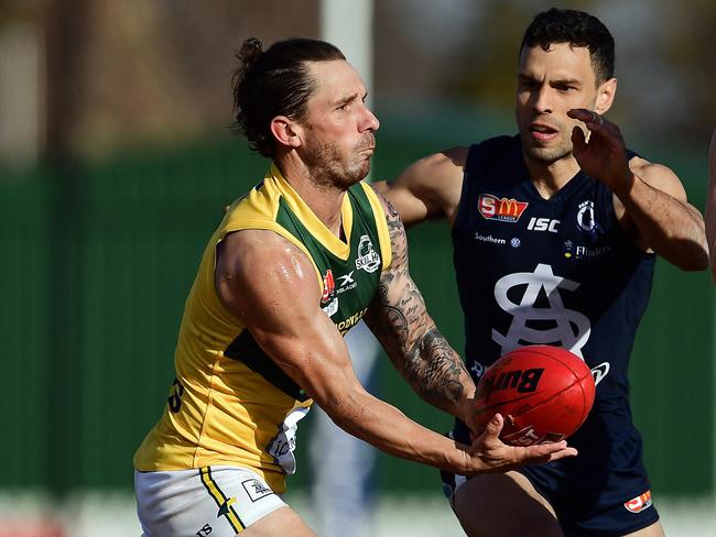 18/08/18 - SANFL: Eagles v South Adelaide at Woodville Oval.  Eagles' James Boyd fires out a handpass.Picture: Tom Huntley