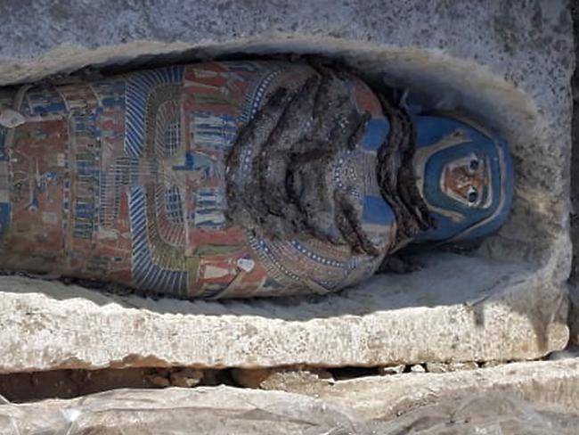 A handout picture released by the Egyptian Ministry of Antiquities on November 28, 2018 shows a newly-uncovered mummy dating back over 2,300 years found by Egyptian archaeologists at a pyramid complex south of Cairo. - "The Egyptian archaeological mission working at the south eastern area of King Amenemhat II’s pyramid in Dahshur Necropolis has uncovered a number of ancient burials with 8 coffins," the antiquities ministry said in a statement. (Photo by - / various sources / AFP) / === RESTRICTED TO EDITORIAL USE - MANDATORY CREDIT "AFP PHOTO / HO / EGYPTIAN MINISTRY OF ANTIQUITIES- NO MARKETING NO ADVERTISING CAMPAIGNS - DISTRIBUTED AS A SERVICE TO CLIENTS ==