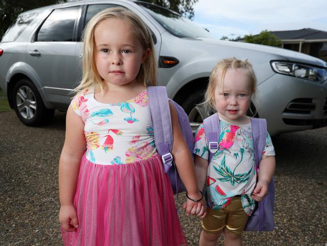 Sophie Bruce, 4, from Rothwell, with her sister Mollie, 2. Sophie was left behind on a child care bus and is still scared every time she gets in a car. Picture: Liam Kidston