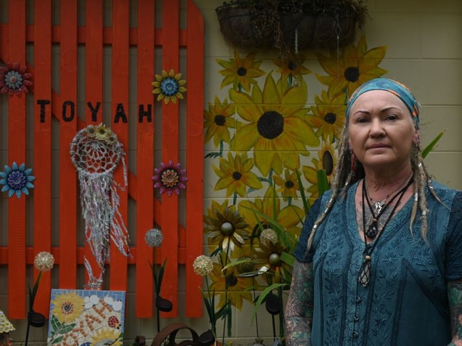 The memorial wall, rich in colour and adorned with handmade ornaments and personal touches, was built by Ms Gardiner at her home in Cairns.  Picture: Emma Cam.