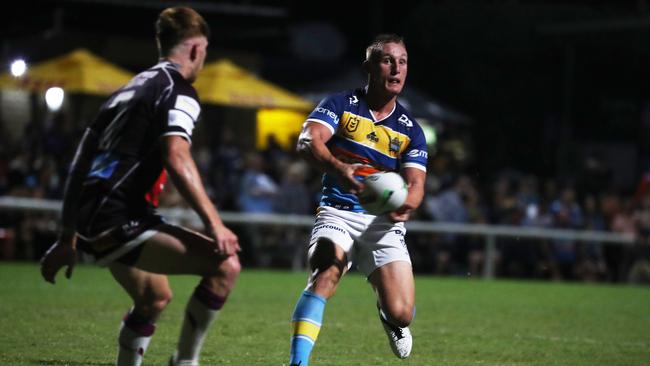 Gold Coast Titans halfback Tanah Boyd passes under pressure from Burleigh Bears halfback Guy Hamilton during a pre-season trial at Pizzey Park. February 20, 2021. Photo Jason O'Brien