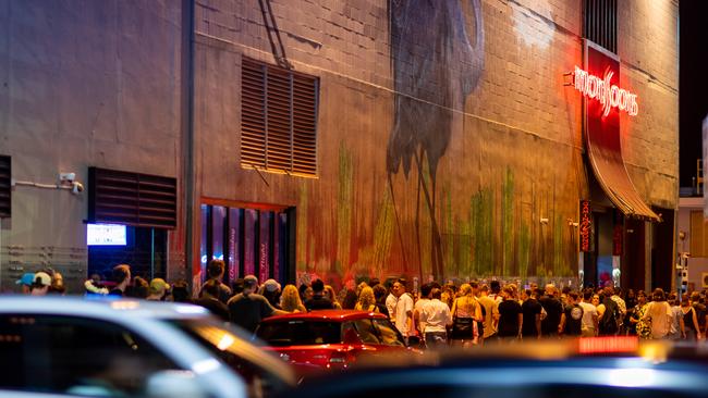 Party crowds line up outside Monsoons in Mitchell Street to celebrate the end of 2020. Picture: Che Chorley