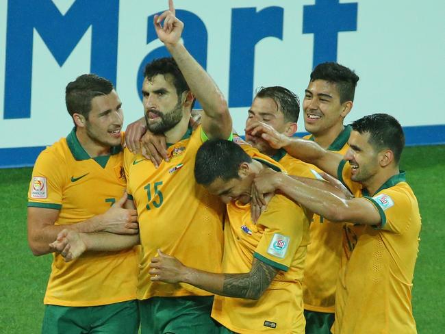 Mile Jedinak is congratulated by his teammates after scoring against Kuwait.