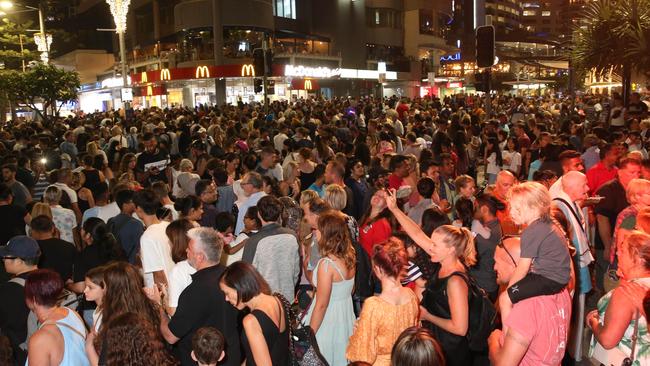 New Year’s Eve 2019 Gold Coast style, crowds watch the fireworks from Surfers Paradise beach. Pic Mike Batterham