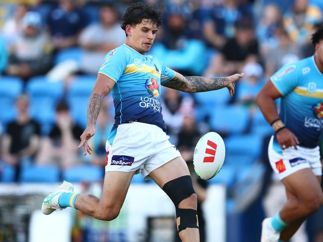 GOLD COAST, AUSTRALIA - JUNE 08: Jayden Campbell of the Titans kicks during the round 14 NRL match between Gold Coast Titans and South Sydney Rabbitohs at Cbus Super Stadium, on June 08, 2024, in Gold Coast, Australia. (Photo by Chris Hyde/Getty Images)