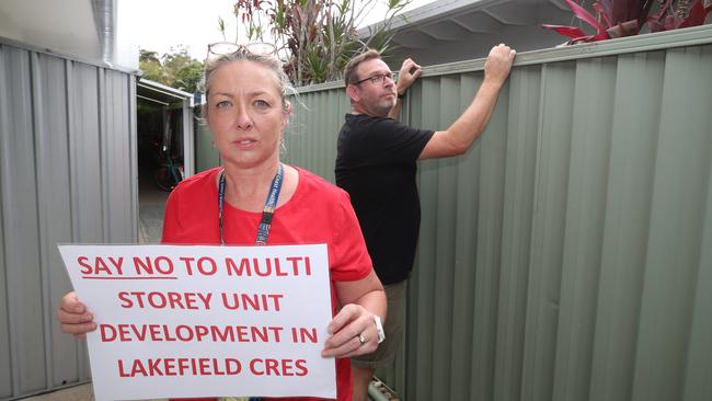 Jason and Alexandra Boulton at the boundary of their property and the proposed development. Picture: Glenn Hampson.