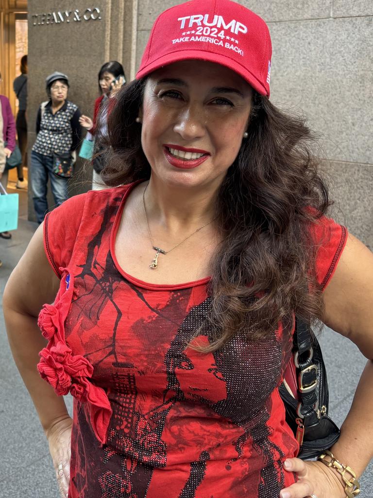 Pinar LaCroix said she was an independent but had donned the red hat to celebrate the election of a president. Picture: Benedict Brook.