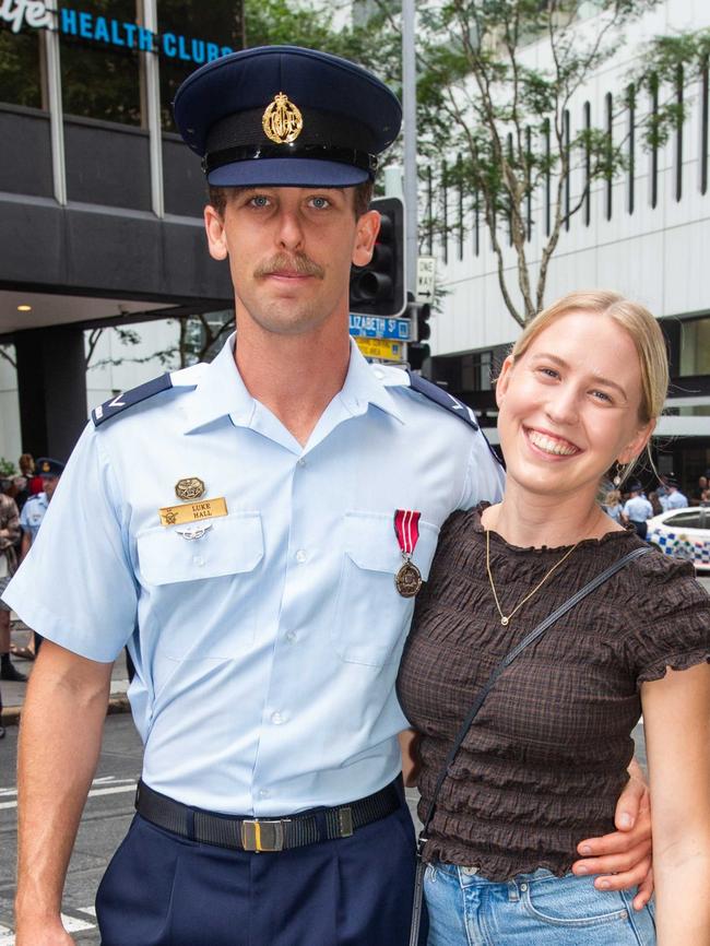 Thousands of people have braved the rain to gather in Brisbane for Anzac Day services. Picture: Grace Kessels