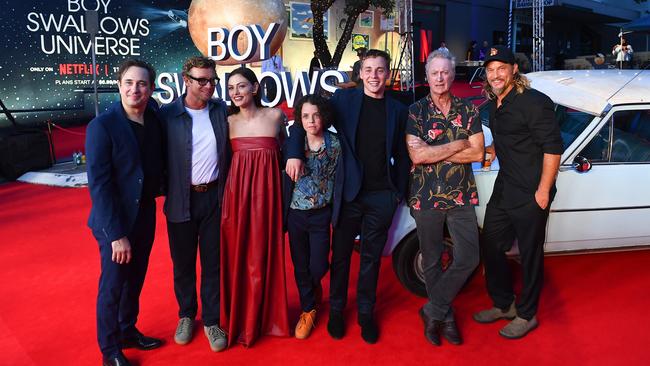 Trent Dalton, Simon Bakerr, Phoebe Tonkin, Felix Cameron, Lee Tiger Halley, Bryan Brown and Travis Fimmel pose during the Netflix global premiere of Boy Swallows Universe at New Farm Cinemas on January 9. Picture: Jono Searle/Getty Images for Netflix