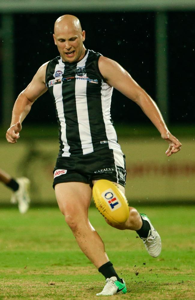 Gary Ablett Jr kicks the ball forward for Palmerston against St Mary’s. Picture: Glenn Campbell