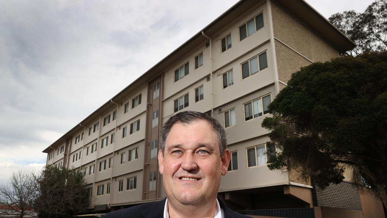 Alinta Energy CEO Jeff Dimery outside the housing commission blocks he grew up in Port Melbourne. Picture: David Caird