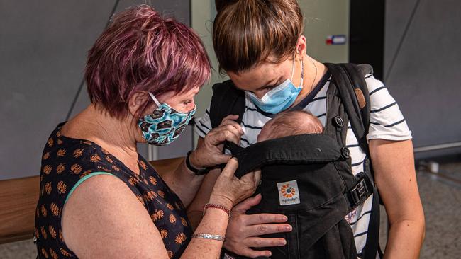 Judy meets her newborn granddaughter for the first time. Picture: Jason Edwards