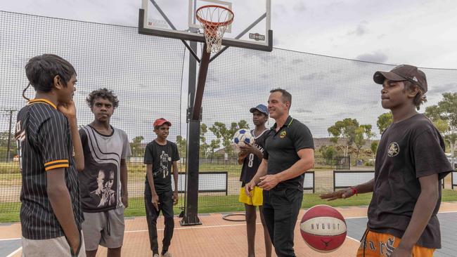 Yipirinya School principal Gavin Morris with, from left, students Jahquille Stuart, Malikai Hayes, Keylin Peters, Akiel Douglas and Adrian Nelson. Picture: Grenville Turner