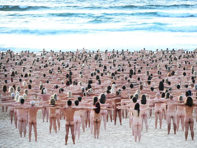 SYDNEY, AUSTRALIA - NewsWire Photos NOVEMBER 26, 2022: Sydney-siders strip bare naked at Bondi Beach this morning for a Spencer Tunick photograph to raise awareness on the importance of early detection for skin cancer.Picture: NCA NewsWire / Jeremy Piper