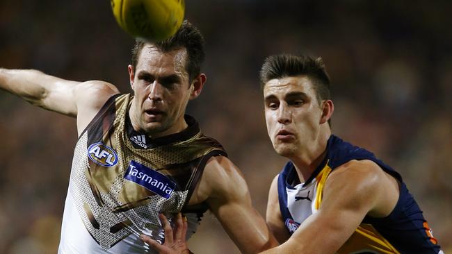 Luke Hodge is pushed off the ball by Eagle Elliott Yeo during last year’s loss to West Coast in the qualifying final. Picture: Wayne Ludbey