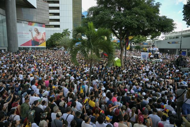 Opponents of Venezuelan President Nicolas Maduro take part in a rally with opposition leaders in Caracas