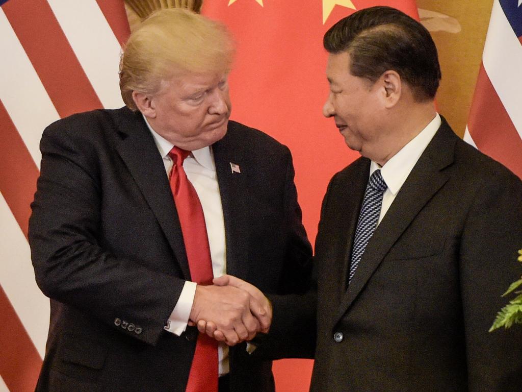 US President Donald Trump and China's President Xi Jinping shake hands. Picture: Fred Dufour