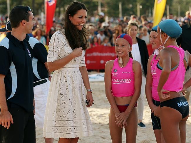 Meeting the locals ... the Duchess of Cambridge meets some girls from the local surf life saving clubs at Manly Beach. Picture: Toby Zerna