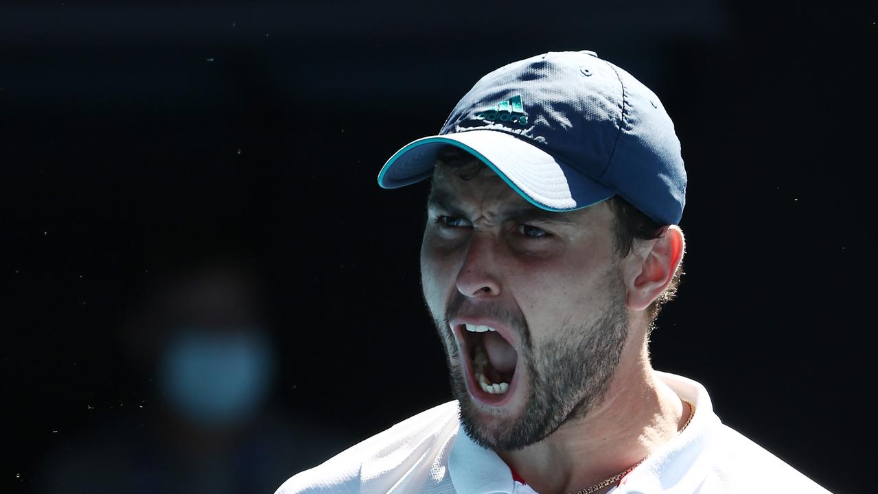 Aslan Karatsev of Russia celebrates after winning match point.