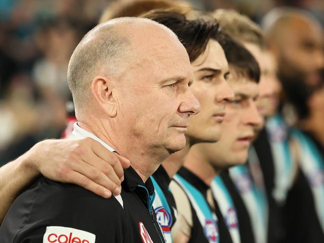 ADELAIDE, AUSTRALIA - SEPTEMBER 05: Ken Hinkley, Senior Coach of the Power during the national anthem during the 2024 AFL Second Qualifying Final match between the Port Adelaide Power and the Geelong Cats at Adelaide Oval on September 05, 2024 in Adelaide, Australia. (Photo by James Elsby/AFL Photos via Getty Images)