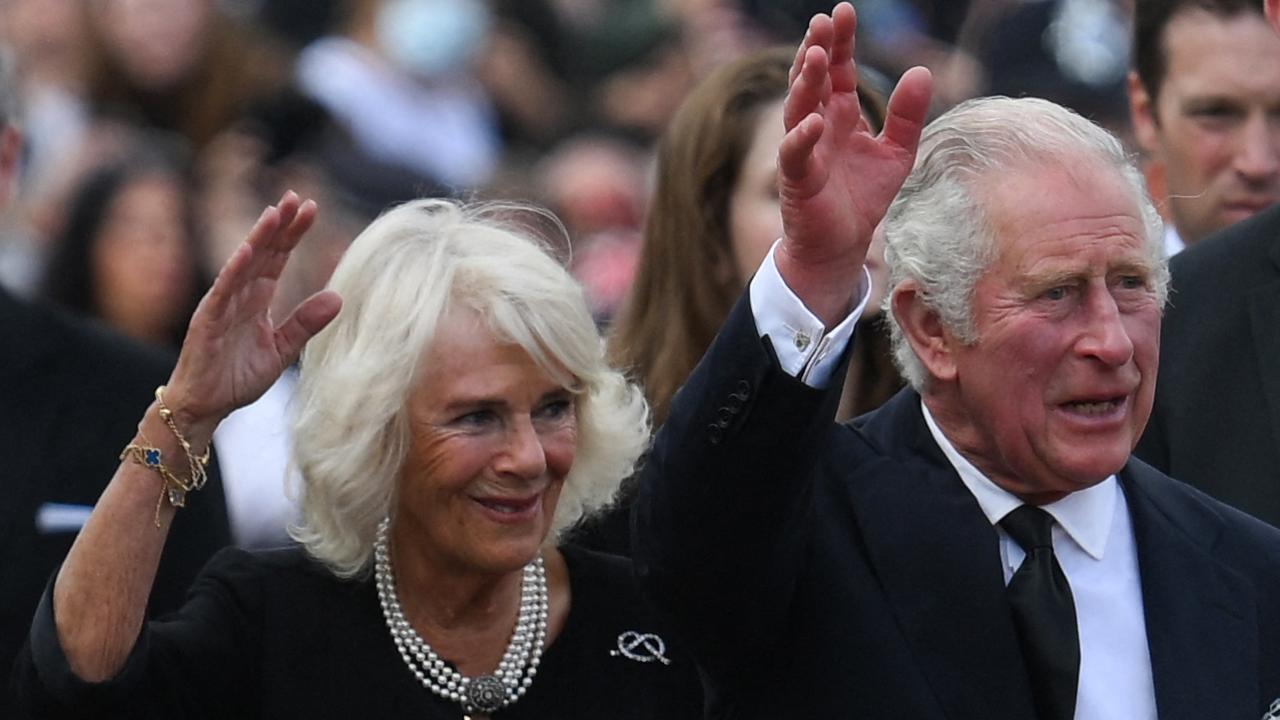 Britain's King Charles III and Camilla, Queen Consort wave as they greet the crowd upon their arrival Buckingham Palace in London a day after Queen Elizabeth II died. Picture: AFP