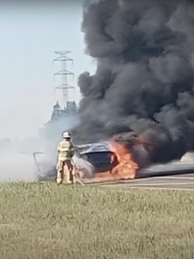 A teenager leapt from her car moments before it burst into flames on the Salisbury Highway. Picture: 7 NEWS