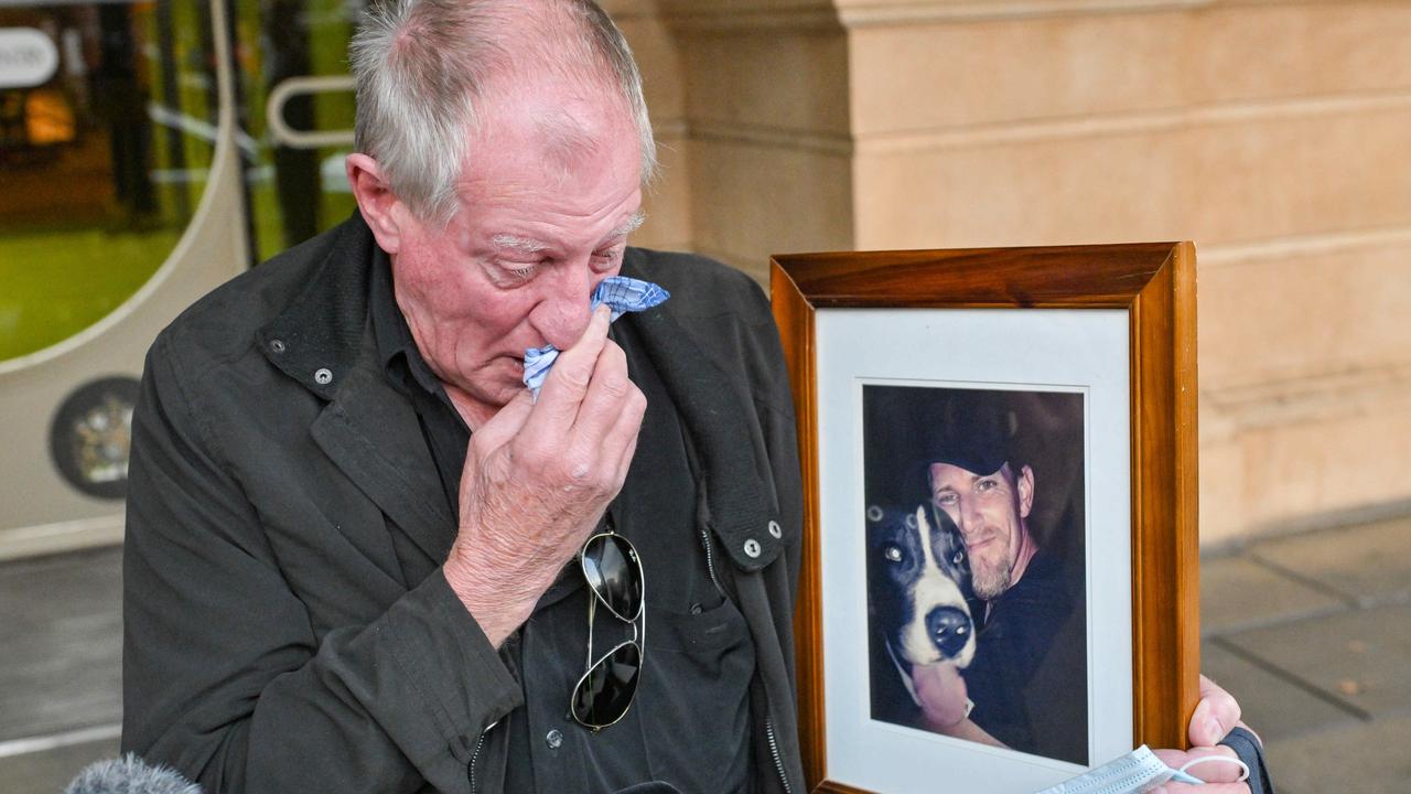 Malcolm Boyce, father of Mark Boyce, with a picture of his son after giving a victim impact statement. Picture: Brenton Edwards