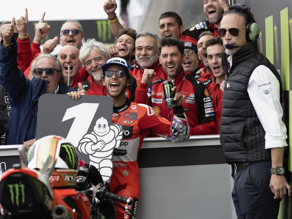 NORTHAMPTON, ENGLAND - AUGUST 04:  Enea Bastianini of Italy and Ducati Lenovo Team celebrates the victory with team under the podium during the MotoGP race during the MotoGP Of Great Britain - Race at Silverstone Circuit on August 04, 2024 in Northampton, England. (Photo by Mirco Lazzari gp/Getty Images)