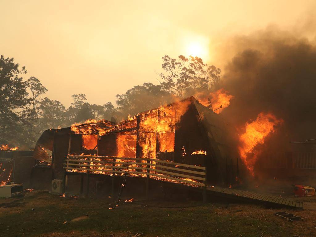 House is lost to the fire on Hassall rd, Bruxton. Bushfire surrounds the town of Buxton in the Southern Highlands as Rural Fire Service work to protect as many homes as they can. Picture: Rohan Kelly