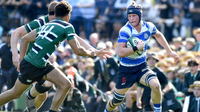 Nudgee player Patrick Dallimore tracked down by Samson Tuqiri (left) in a GPS first XV rugby clash between Nudgee and BBC. Saturday August 6, 2022. Picture, John Gass