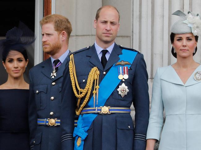 (FILES) In this file photo taken on July 10, 2018 (L-R) Britain's Meghan, Duchess of Sussex, Britain's Prince Harry, Duke of Sussex, Britain's Prince William, Duke of Cambridge and Britain's Catherine, Duchess of Cambridge, stand on the balcony of Buckingham Palace on July 10, 2018 to watch a military fly-past to mark the centenary of the Royal Air Force (RAF). - Meghan Markle has experienced remarkable highs and lows during a tumultuous period in which she married into royalty and became a mother before souring on life in Britain and returning to the United States. The 39-year-old American former television actress shot to global stardom with her engagement to Prince Harry in 2017 and their fairytale wedding six months later. She gave birth to their son, Archie, in 2019. (Photo by Tolga AKMEN / AFP)