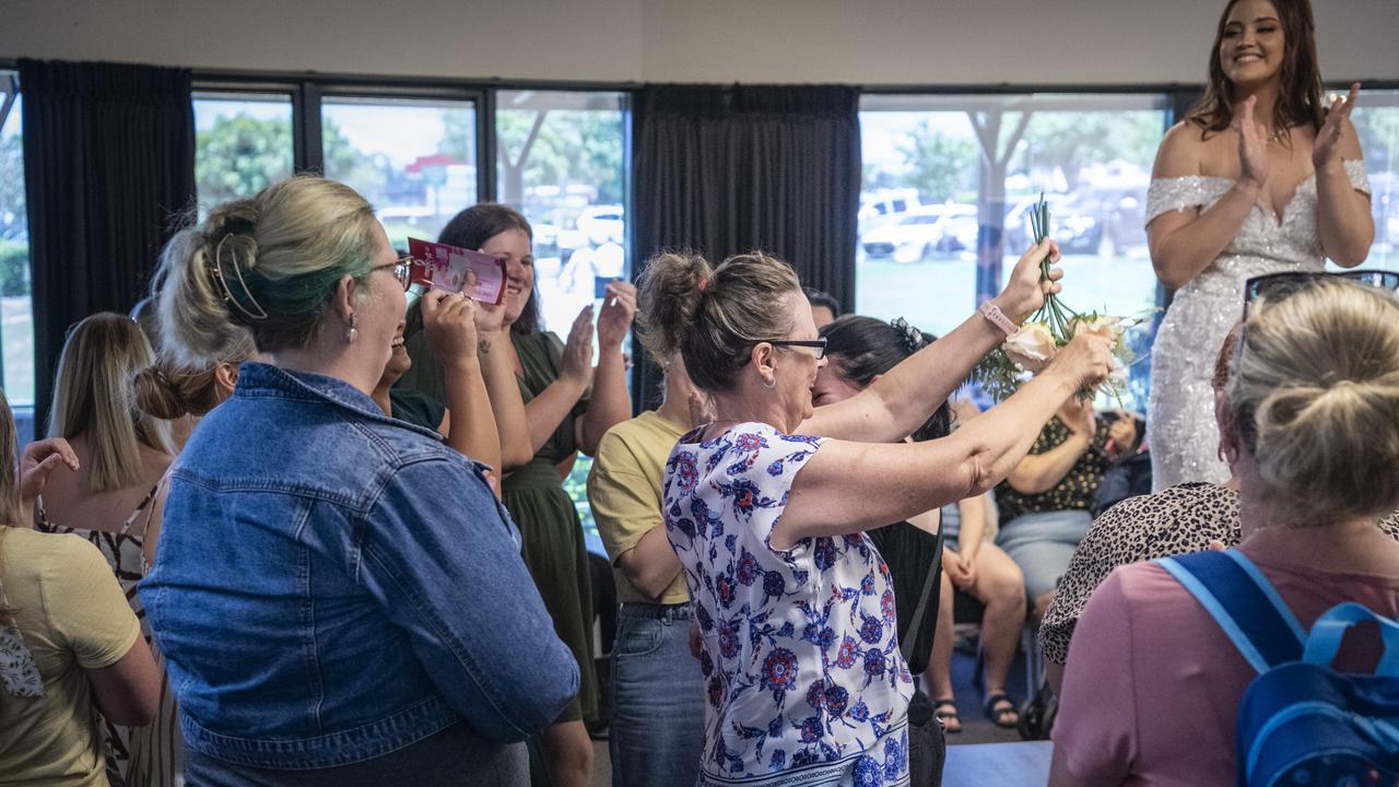 Sarita Du Plessis catches a bouquet for her daughter Chantal as part of a competition to win a voucher for A Touch of Romance at the end of the fashion show at Toowoomba's Wedding Expo hosted by Highfields Cultural Centre, Sunday, January 21, 2024. Picture: Kevin Farmer