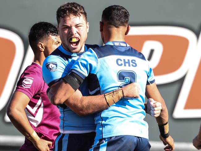 NSW's Ethan Ferguson celebrates after scoring atry during the under 18 ASSRL schoolboy rugby league championship grand final between QLD v NSW CHS from Moreton Daily Stadium, Redcliffe. Picture: Zak Simmonds