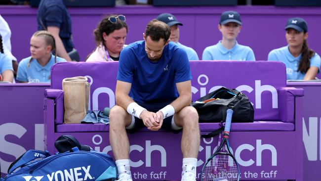 Andy Murray of Great Britain looks dejected as he is forced to pull out of the match due to injury against Jordan Thompson. (Photo by Clive Brunskill/Getty Images)