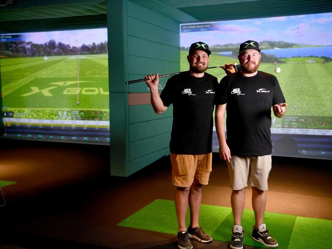 Dan Blinkhorn and Matt Smith at the X-Golf in Townsville, North Queensland that opened in June 2022. Picture: Evan Morgan