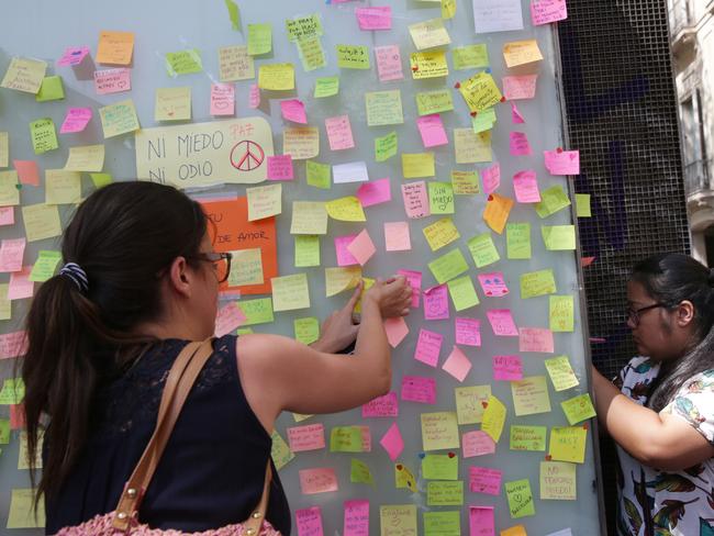 People leave notes on Las Ramblas after a terrorist attack killed at least 14 people. Picture: Ella Pellegrini