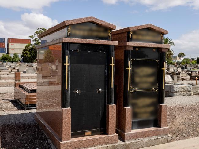 Blurred Version. The other damaged grave. Footscray General Cemetery, A coffin is exposed with police, detectives and forensics examining the area. Picture: Jason Edwards